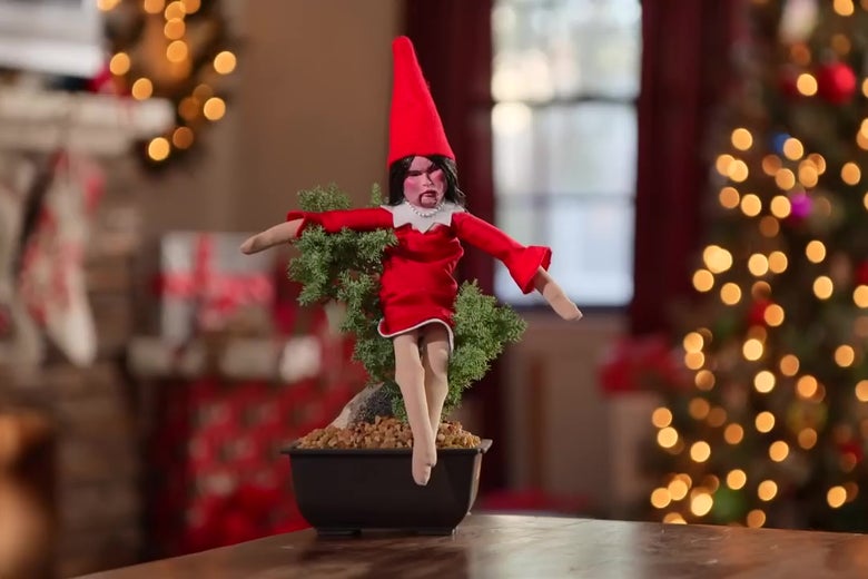 A ghastly looking Sarah Huckabee Sanders doll on a Christmas tree.